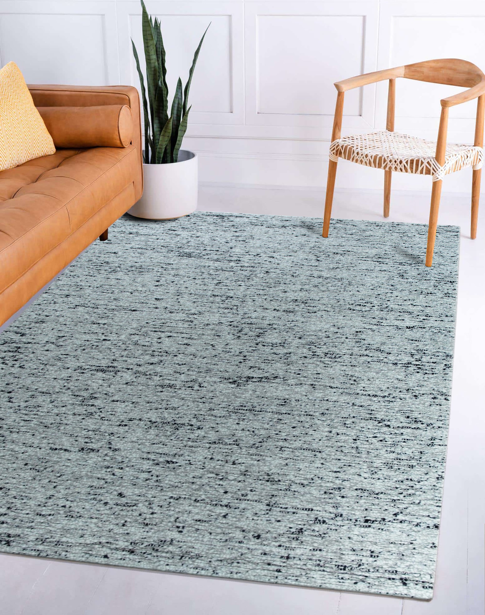 Opulent Alluring Dark Gray Handmade Wool Rug, showcasing its rich, dark gray hue and handcrafted texture in a stylish living room setting.