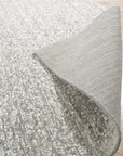 Opulent Alluring Silver Handmade Wool Rug, its shimmery silver tones and textured wool construction catching the light, adds subtle luxury to a bright, airy space.