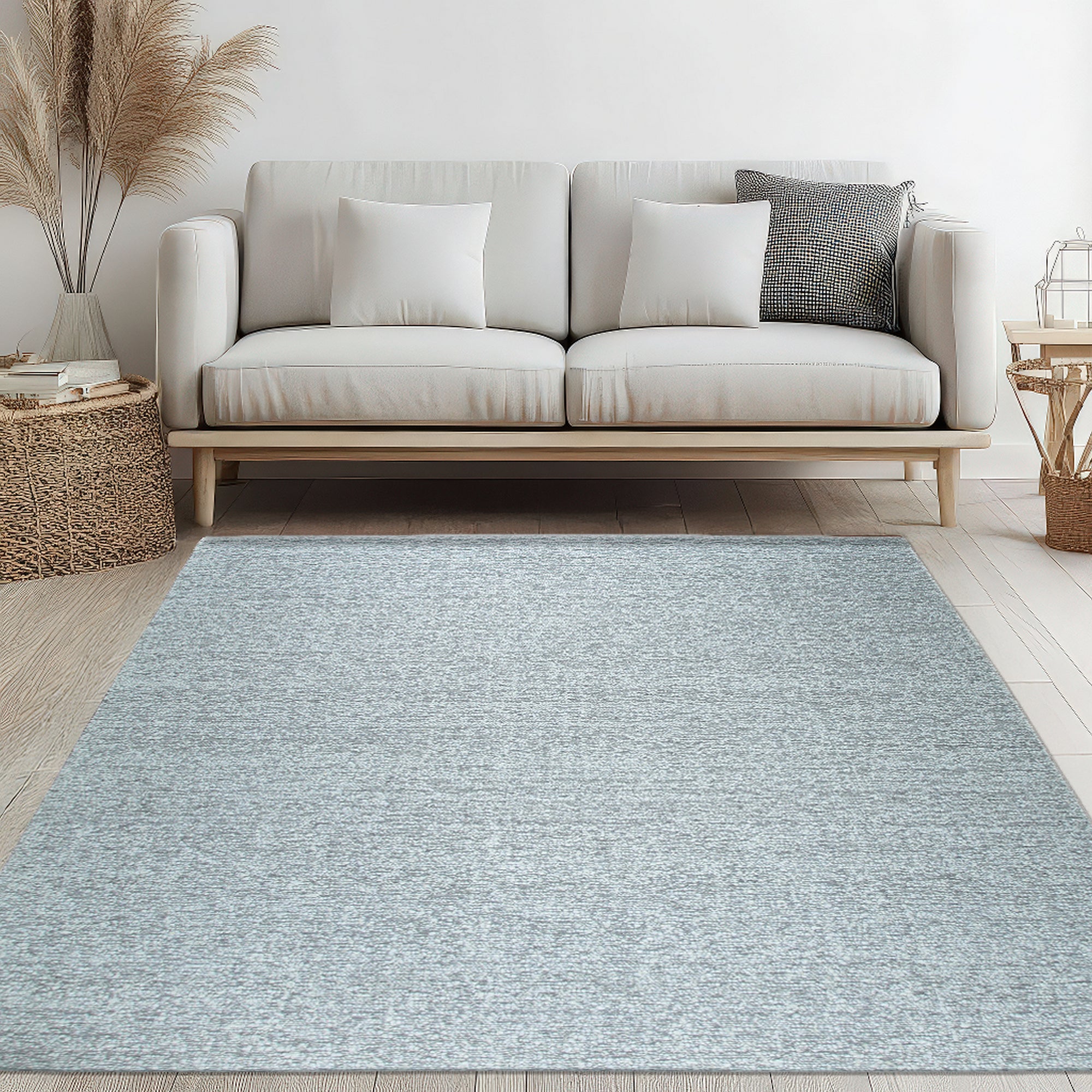 Opulent Alluring Silver Handmade Wool Rug, its subtle sheen catching the light in a bright, contemporary living room setting.