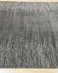 Tessa Maya Gray Hand Knotted Wool Rug, its neutral palette and subtle design blending seamlessly into a contemporary living space.