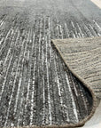 Tessa Maya Gray Hand Knotted Wool Rug, its subtle gray tones and hand-knotted texture adding warmth to a modern living space.