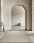 Freya Graceful Pink Handmade Wool Rug, soft pink hues and hand-knotted wool create a warm, inviting texture in a modern living space.