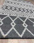 Modern Kilim Black Handmade Wool Rug, richly textured in deep black wool, anchoring a contemporary living room with its geometric kilim design.