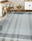 Giselle Serene Multicolor Flatweave Wool Rug, seen in a bright living space, showcases its vibrant blend of colors and flatweave texture, adding a serene and stylish touch to the room.