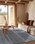 Dazzling Chic Gray Hand Knotted Wool & Viscose Rug, featuring subtle sheen and intricate knotting, displayed on a light wood floor with natural lighting highlighting its texture.