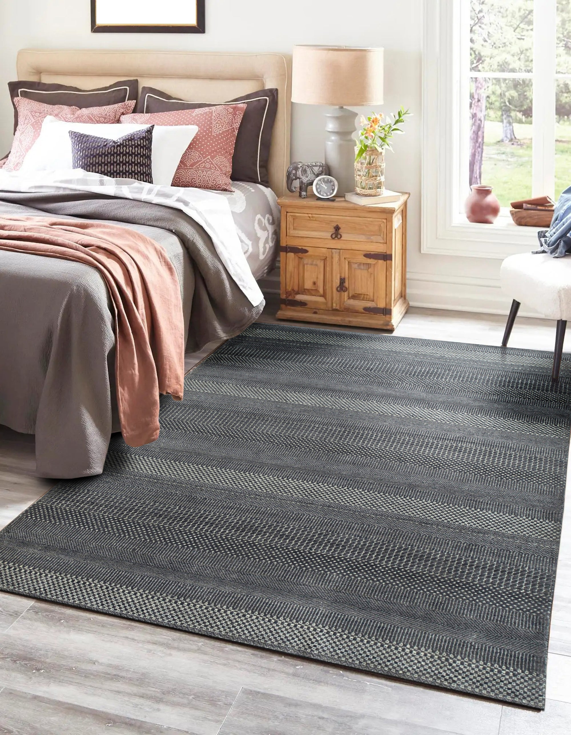 Dazzling Chic Gray Hand Knotted Wool & Viscose Rug, a gray wool and viscose rug featuring a subtle, shimmering design, seen in a bright living space enhancing the modern aesthetic.