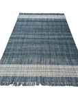 Delicate Elena Blue Flatweave Wool Rug, seen in a bright, inviting space; its flatweave construction and subtle blue hues add a touch of understated elegance.