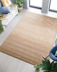 Vibrant Kira Beige Handmade Wool Rug, soft beige tones dance across a hand-knotted wool surface, offering a subtle pattern in a cozy living space.