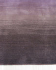 Rhea Unique Multicolor Handmade Wool Rug, showcasing vibrant hues and intricate patterns; a burst of handcrafted warmth and artistry in a sunlit room setting.