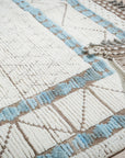 Timeless Marrakech Ivory Hand-Knotted Wool Rug, blending seamlessly into a softly lit living room, its plush ivory pile inviting touch, geometric Moroccan patterns adding subtle depth to the minimalist décor.