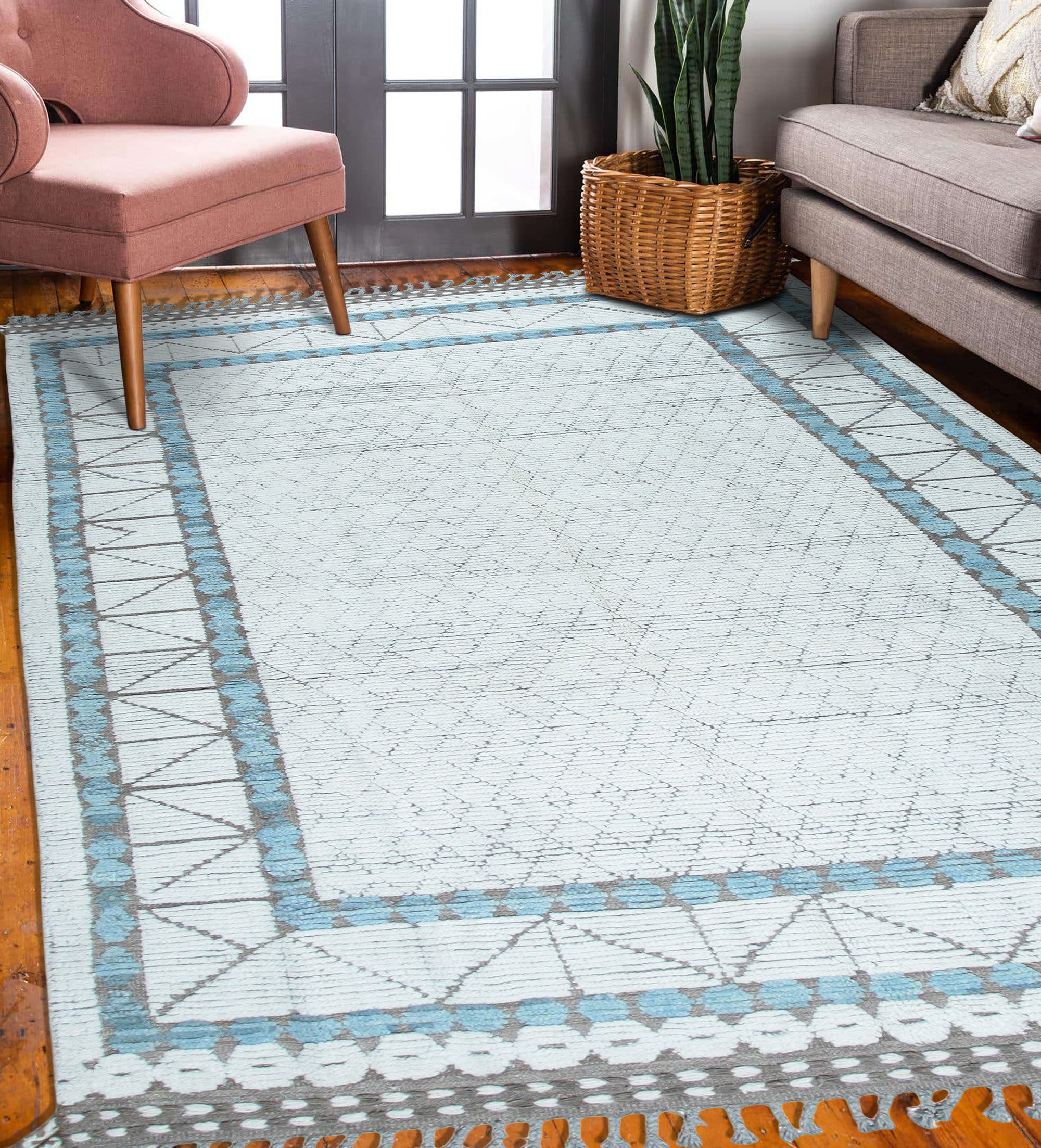 Timeless Marrakech Ivory Hand-Knotted Wool Rug, with intricate ivory patterns and textures, displayed in a bright, modern living room.