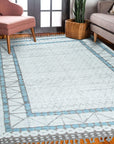 Timeless Marrakech Ivory Hand-Knotted Wool Rug, with intricate ivory patterns and textures, displayed in a bright, modern living room.