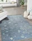 Charming Marrakech Blue Hand-Knotted Wool Rug, showcasing a vibrant blue palette and intricate geometric patterns, displayed in a bright living room setting.
