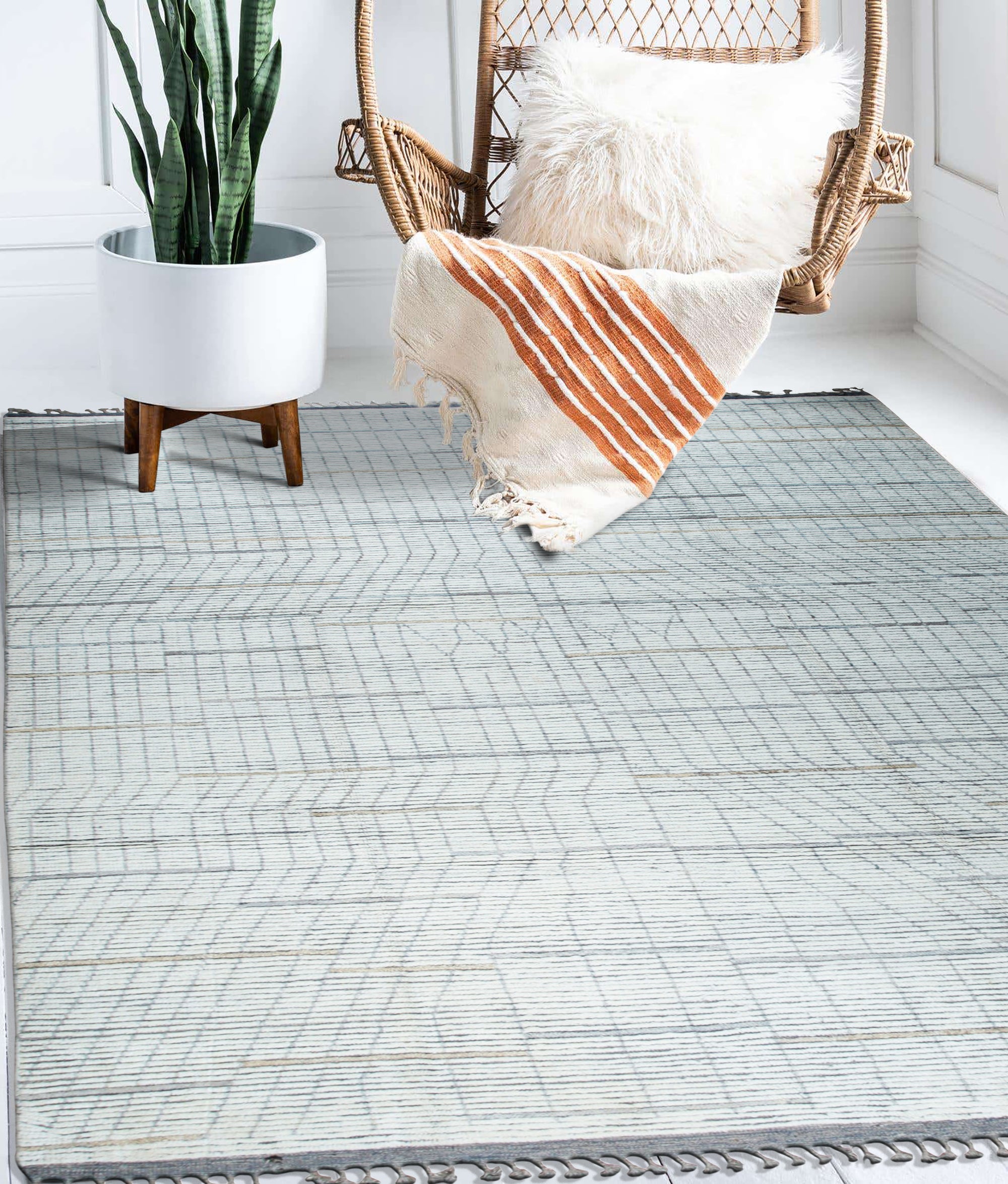 Ornate Marrakech Ivory Hand-Knotted Wool Rug, showcasing intricate patterns and texture in a softly lit interior setting.