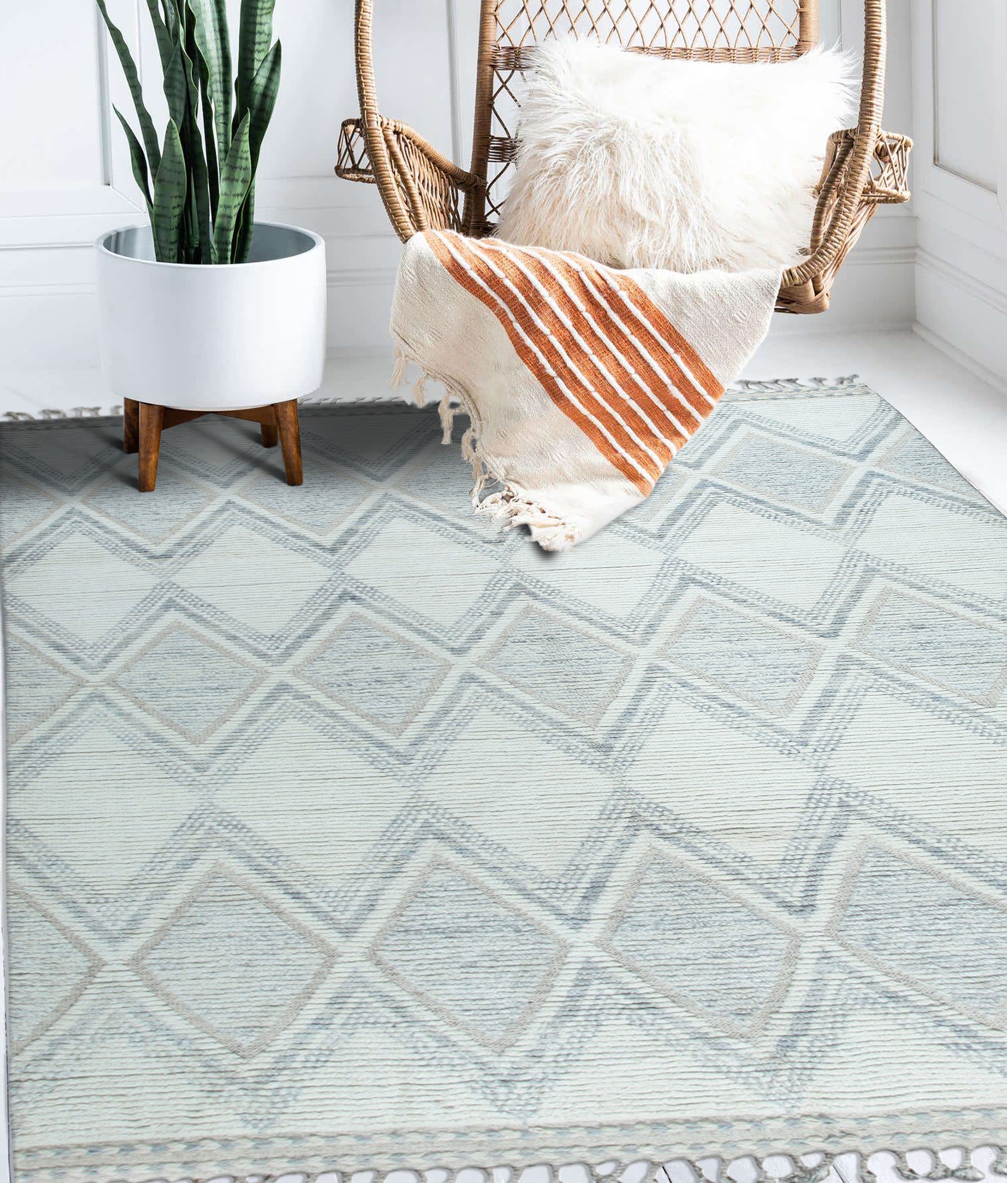 Elegant Marrakech Beige Hand-Knotted Wool Rug, showcasing its intricate beige patterns and textures in a bright, airy living room setting.