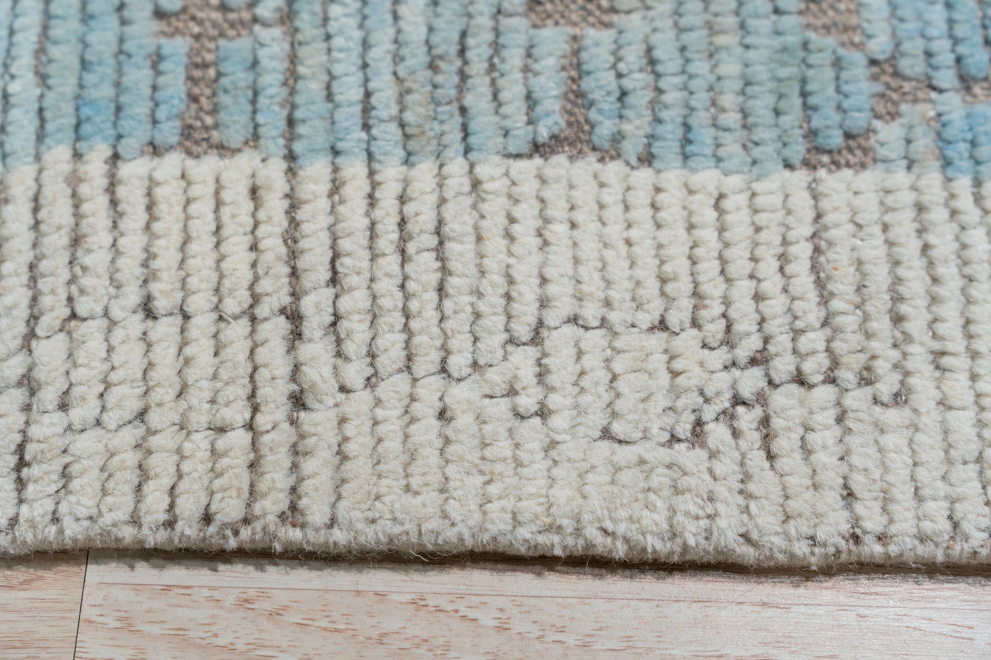 Timeless Marrakech Beige Hand-Knotted Wool Rug, showcasing a classic Moroccan design in warm beige tones, adds texture and warmth to a living space.