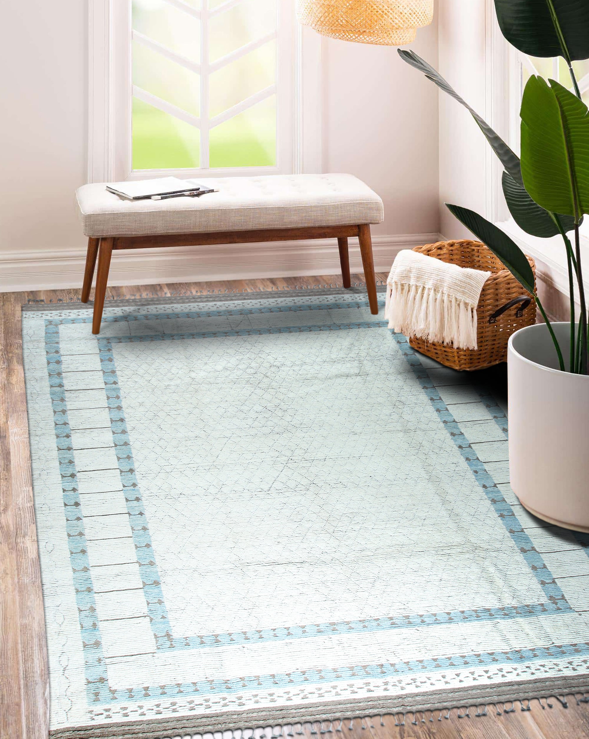Timeless Marrakech Beige Hand-Knotted Wool Rug displayed on a polished hardwood floor. Beige tones and hand-knotted construction evident in the rug's texture and design.