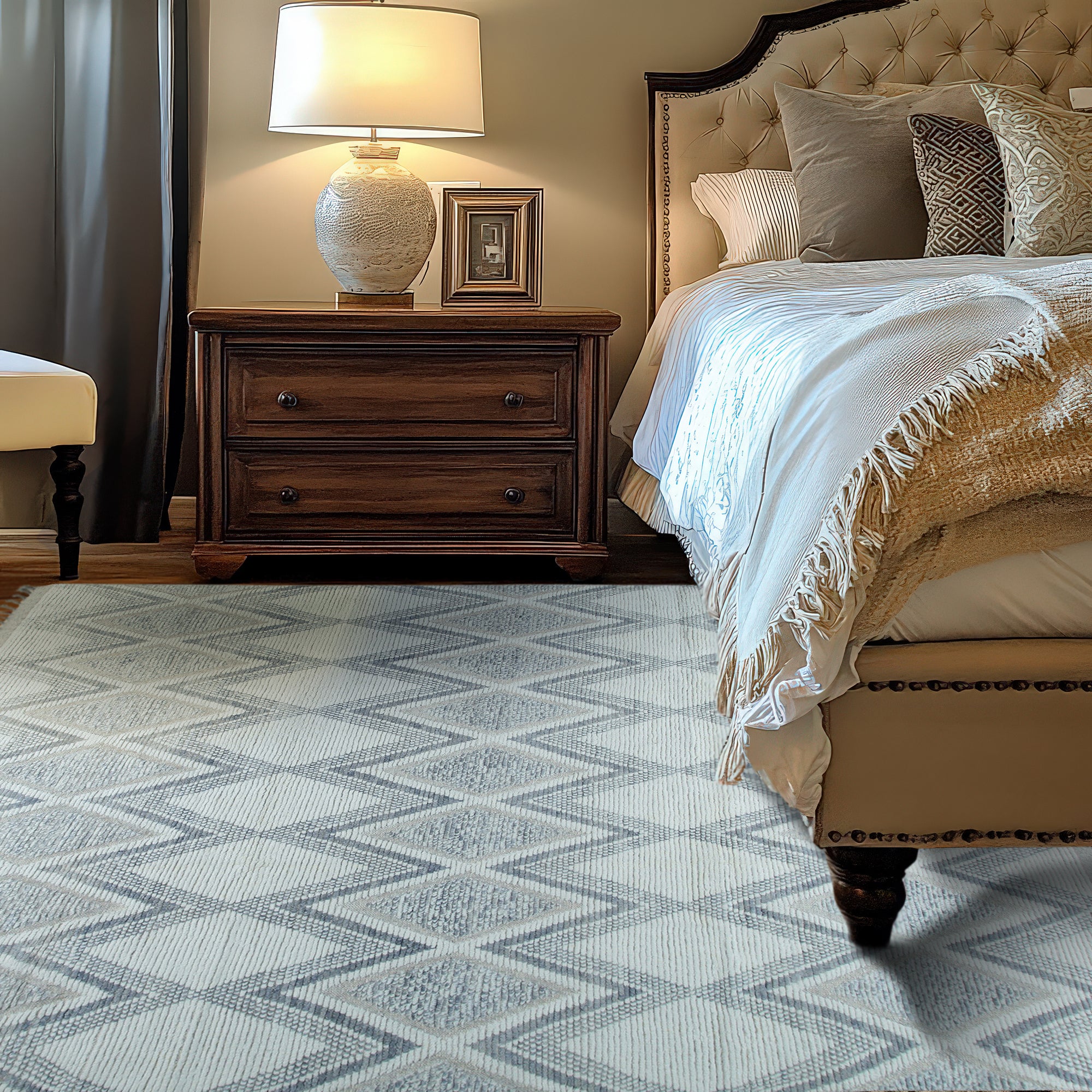 Sophisticated Marrakech Beige Hand-Knotted Wool Rug, showcasing subtle geometric patterns in soft beige tones, displayed on a light wooden floor.