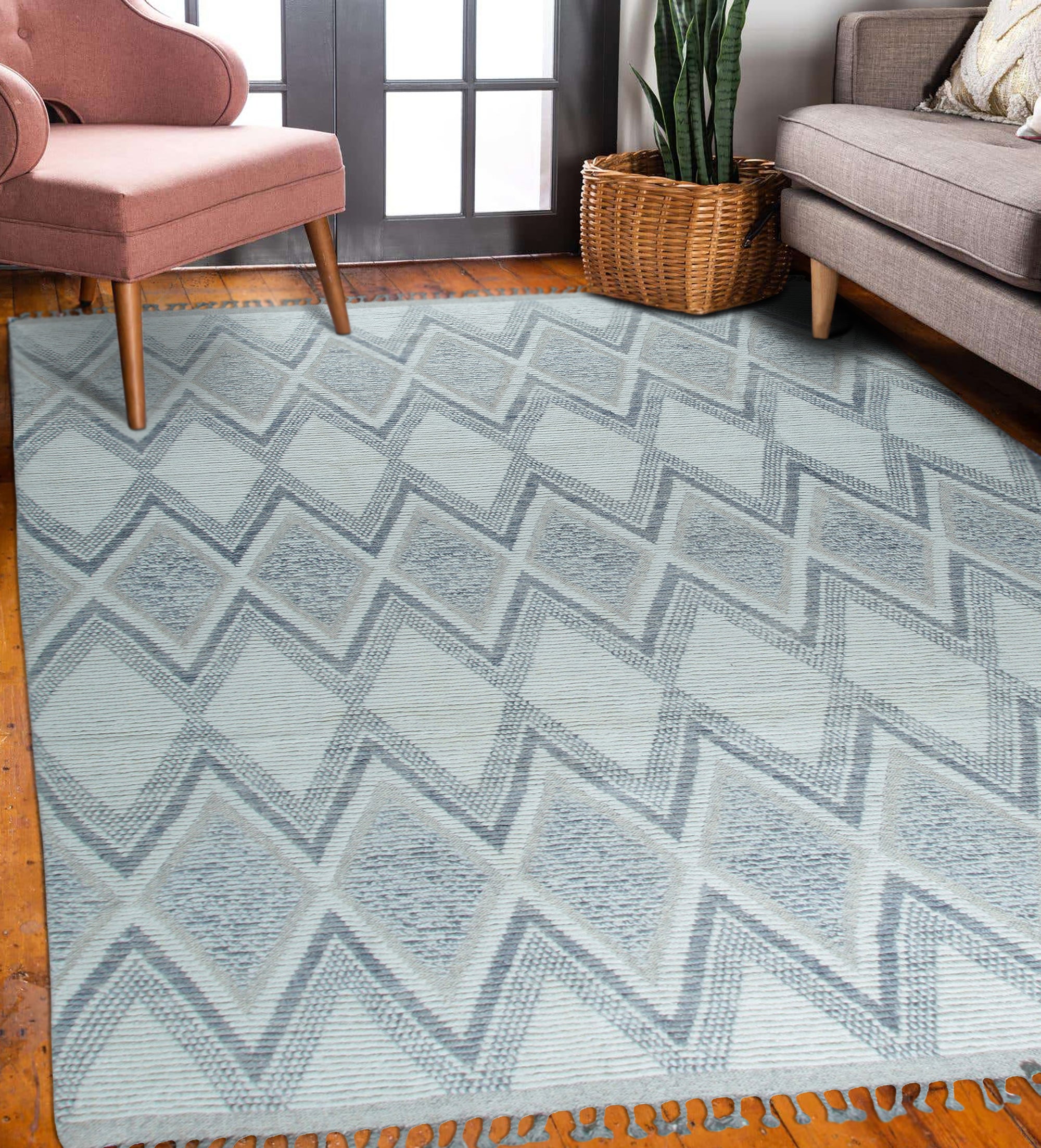 Sophisticated Marrakech Beige Hand-Knotted Wool Rug, showcasing a neutral palette and intricate geometric design, complements a bright living space with a light wood floor and modern furniture.
