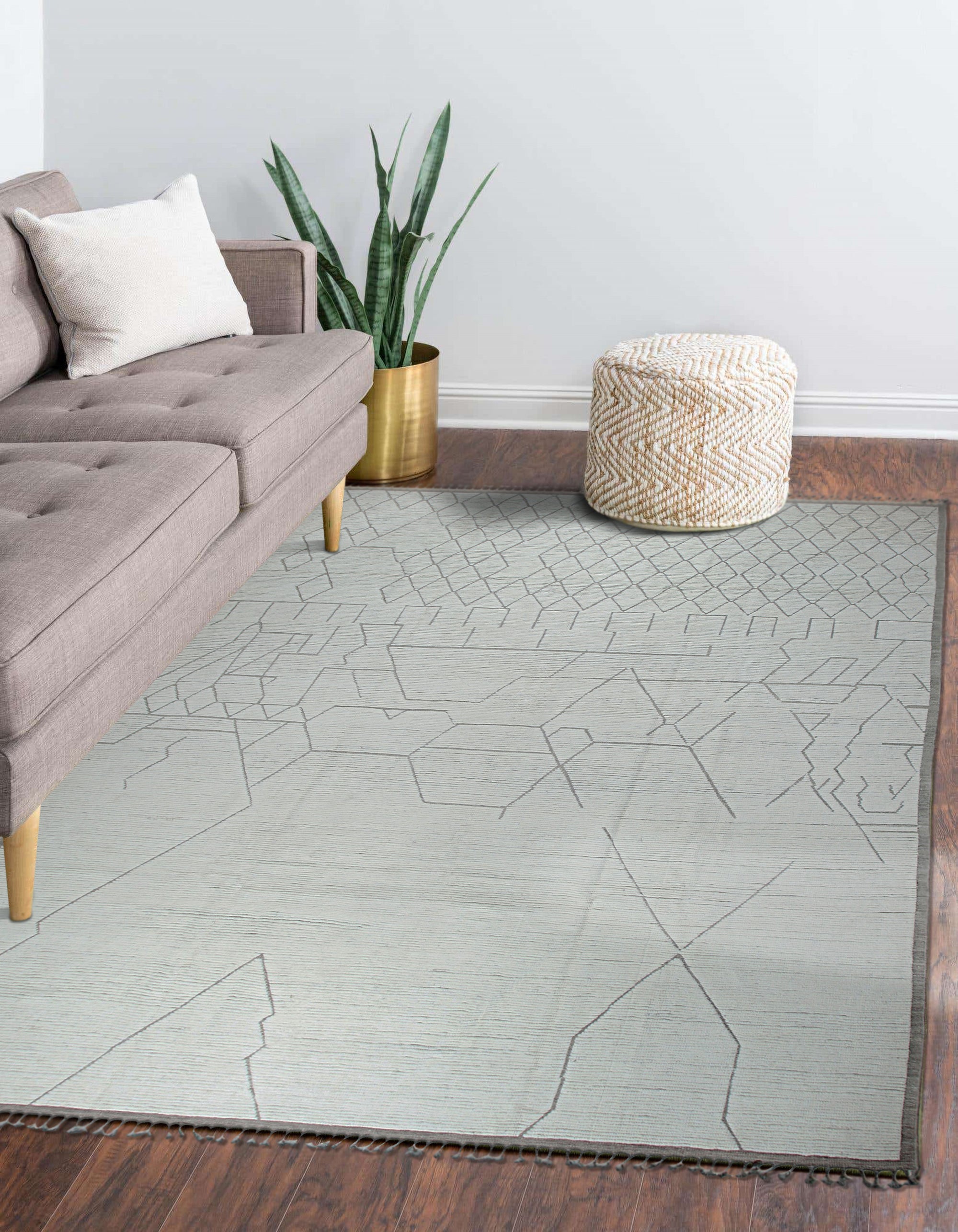 Refined Marrakech Beige Hand-Knotted Wool Rug, a soft beige wool rug with an intricate geometric pattern, subtly textured and lending warmth to a modern living space.