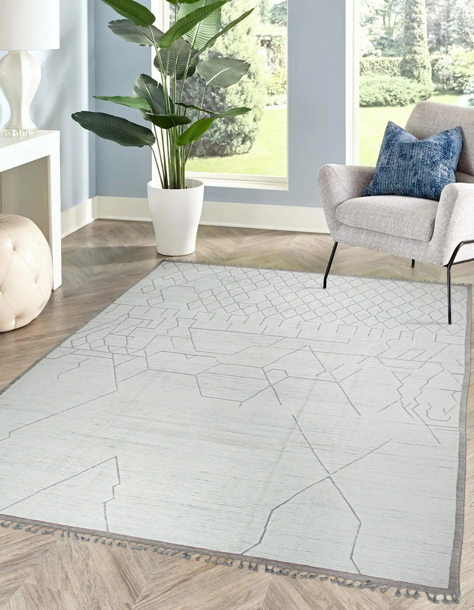 Refined Marrakech Beige Hand-Knotted Wool Rug, blending seamlessly into a bright living room; its intricate patterns adding subtle texture beneath a modern coffee table.
