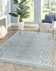 Subtle Marrakech Ivory Hand-Knotted Wool Rug, with subtle geometric patterns in soft ivory tones, showcased in a modern living room setting with natural light.