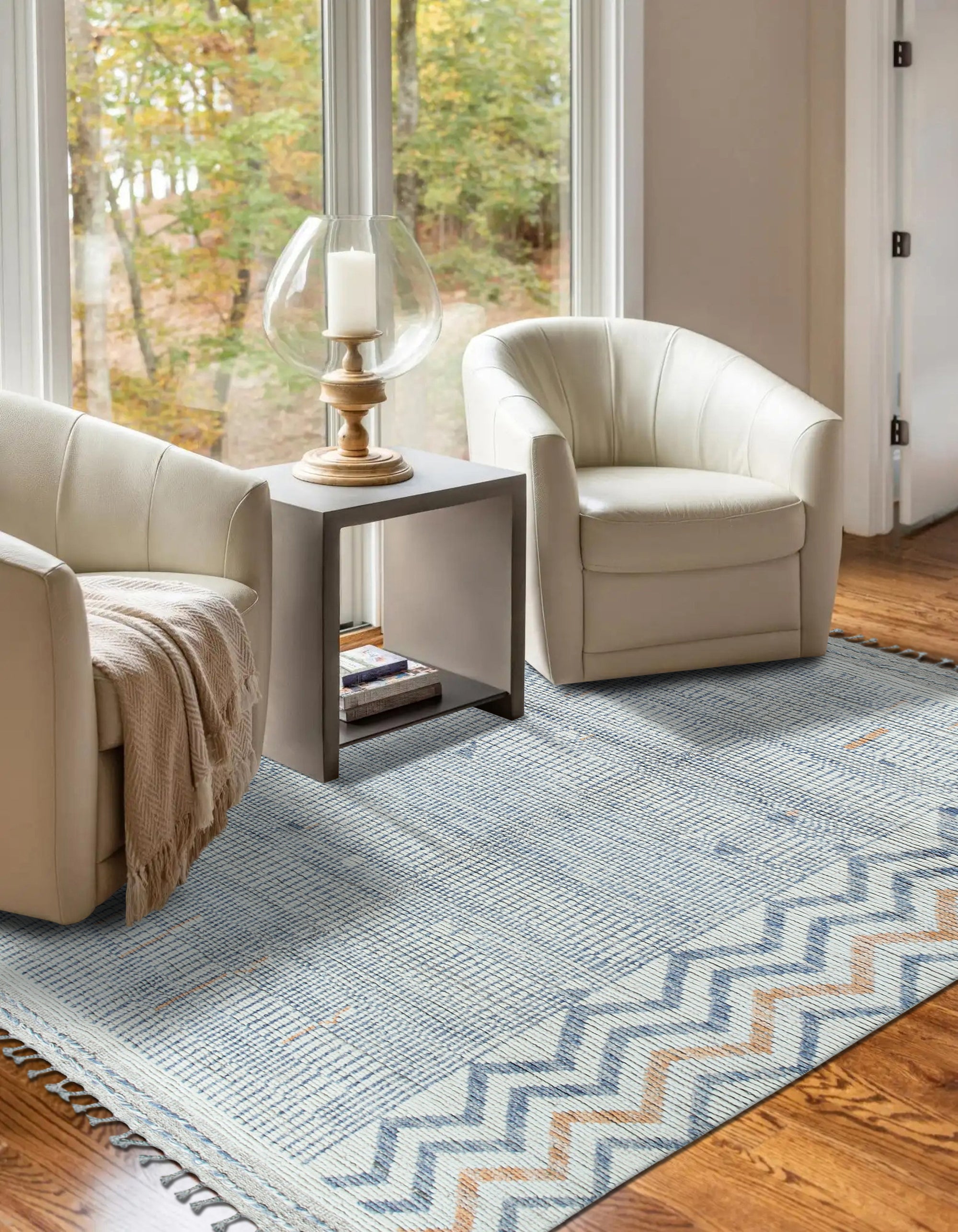 Subtle Marrakech Ivory Hand-Knotted Wool Rug, its textured ivory wool pile softening the light in a neutral living room setting.