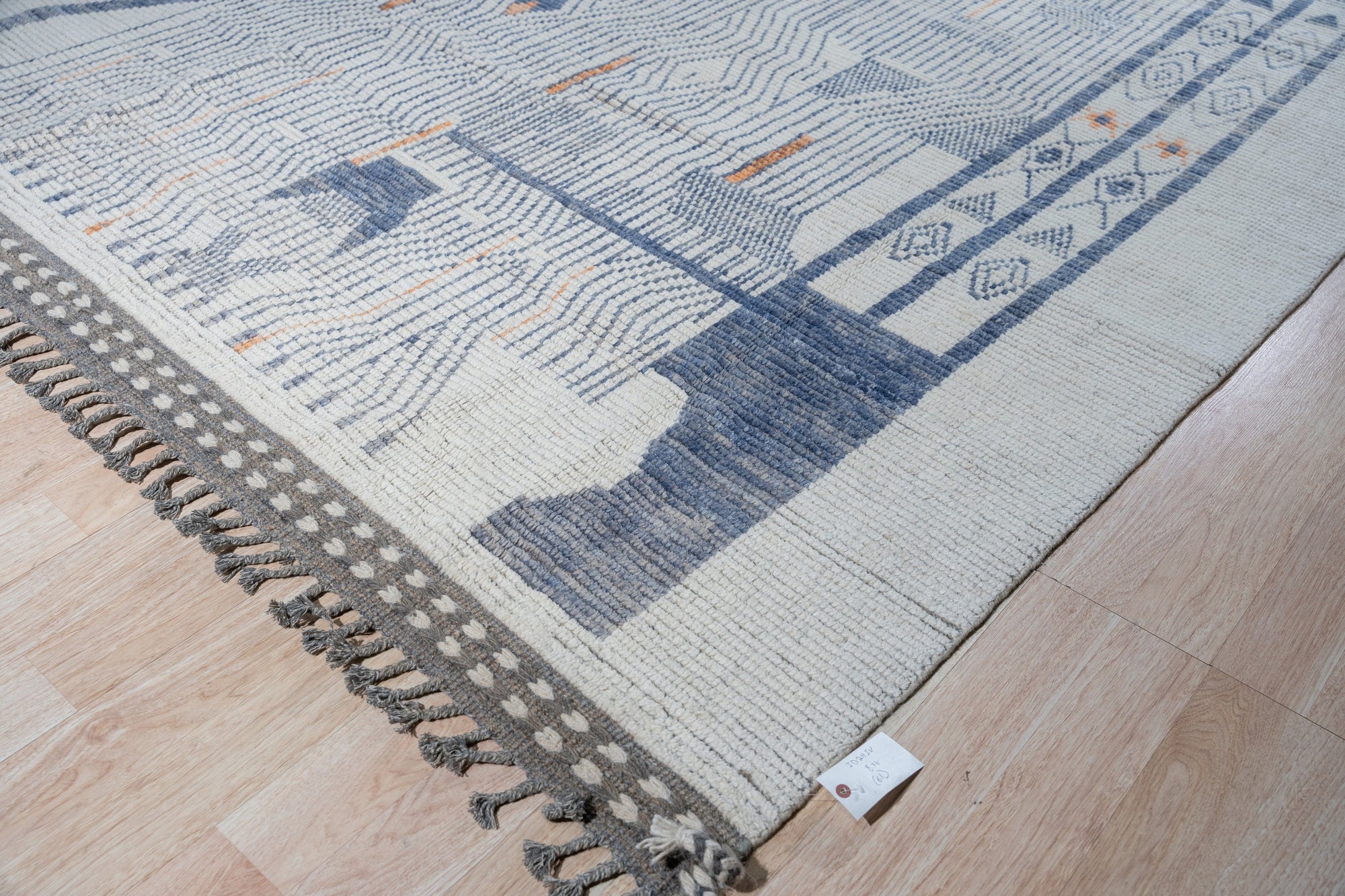 Abstract Marrakech Ivory Hand-Knotted Wool Rug, featuring a creamy ivory palette and abstract design, showcased in a bright, modern living space.