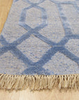 Classic Lush Blue Hand Knotted Wool & Viscose Rug, a deep blue rug with a subtle sheen, its hand-knotted texture visible in a well-lit room setting.