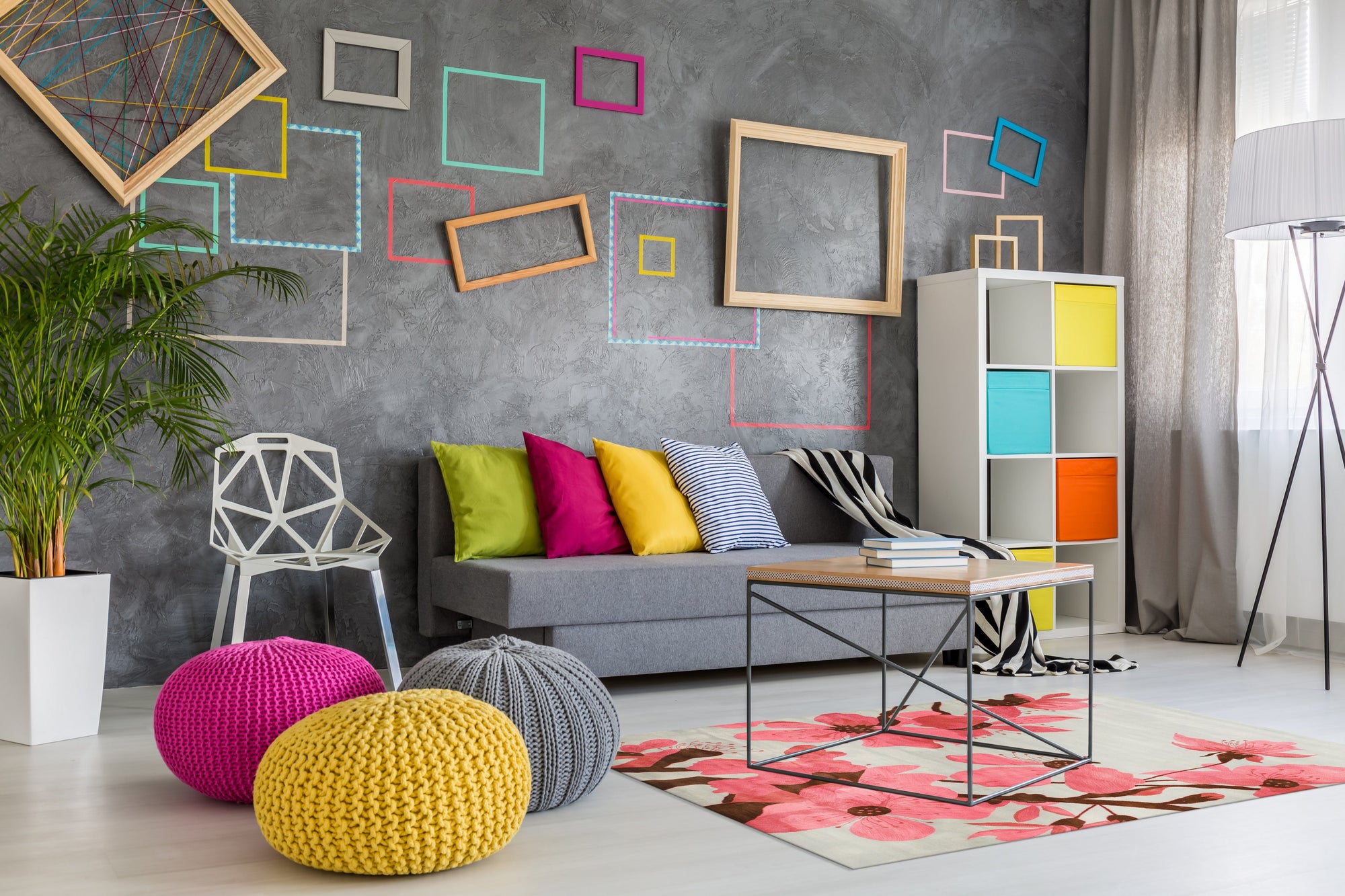 Elena Kira Blue Hand Tufted Wool Rug, a vibrant blue wool rug with a modern, geometric pattern, staged in a bright living room setting.