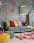 Elena Kira Blue Hand Tufted Wool Rug, a vibrant blue wool rug with a modern, geometric pattern, staged in a bright living room setting.