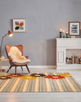 Artistic Maya Multicolor Hand Tufted Wool Rug in a bright, modern living room; its vibrant geometric patterns and soft wool texture add warmth and character to the space.