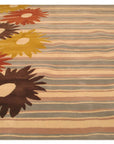 Artistic Maya Multicolor Hand Tufted Wool Rug, vibrant wool fibers swirl in a captivating mosaic of colors, its hand-tufted texture adding depth and warmth to the room.