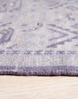 Rhea Elena Purple Hand Knotted Wool Rug, showcasing a vibrant purple palette and intricate hand-knotted construction, lending texture and warmth to a contemporary living space.