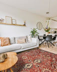 Lush Rustic Rust Hand Knotted Wool Rug, displaying warm rust tones and a hand-knotted construction, laid on a hardwood floor with a subtle woven texture visible.
