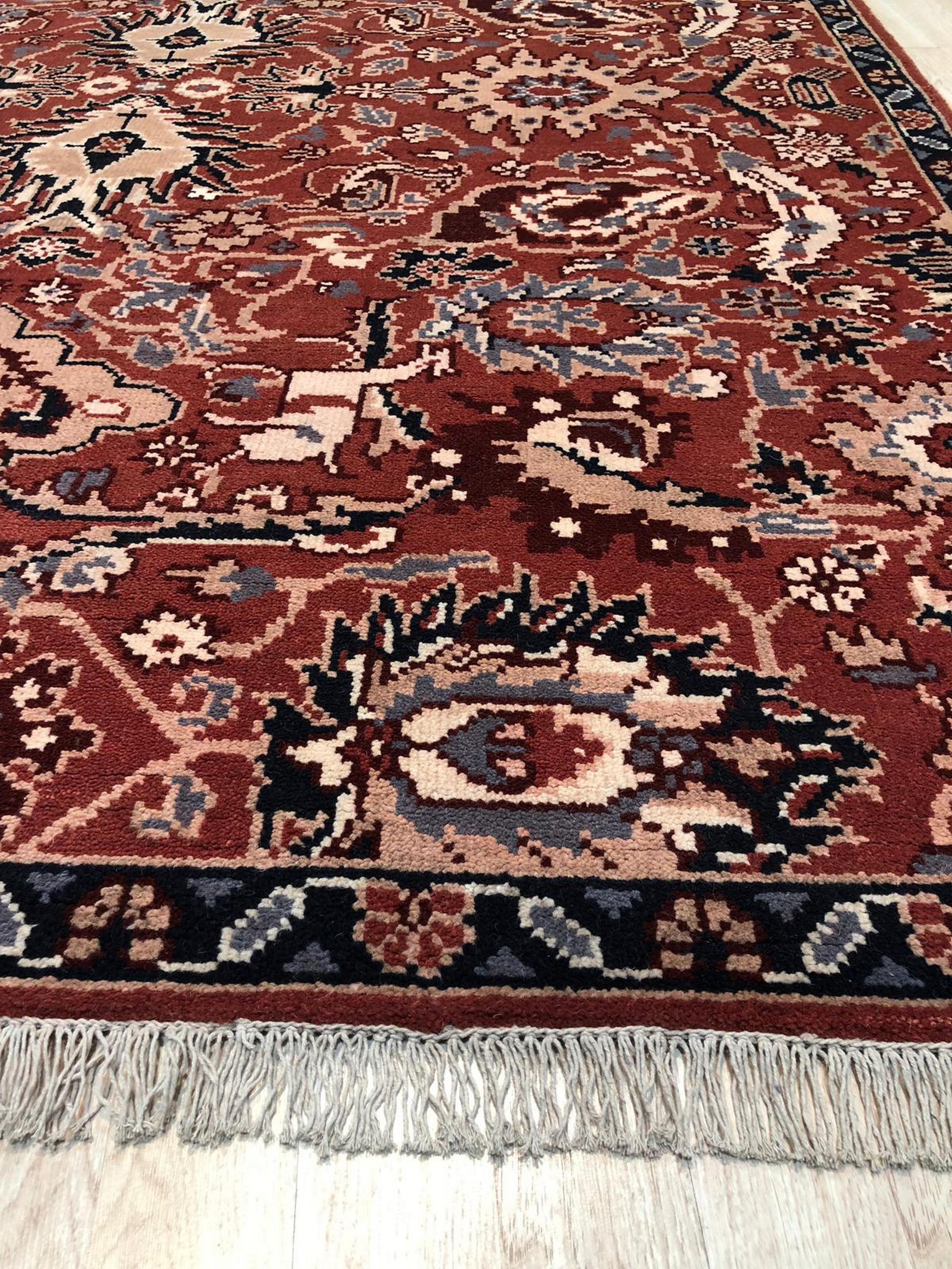 Lush Rustic Rust Hand Knotted Wool Rug, a warm, textural anchor with a rustic, earthy palette, showcased in a warmly lit interior setting.