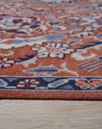 Lush Rustic Rust Hand Knotted Wool Rug, rich rust hues interwoven in a hand-knotted construction, displayed in a room setting.