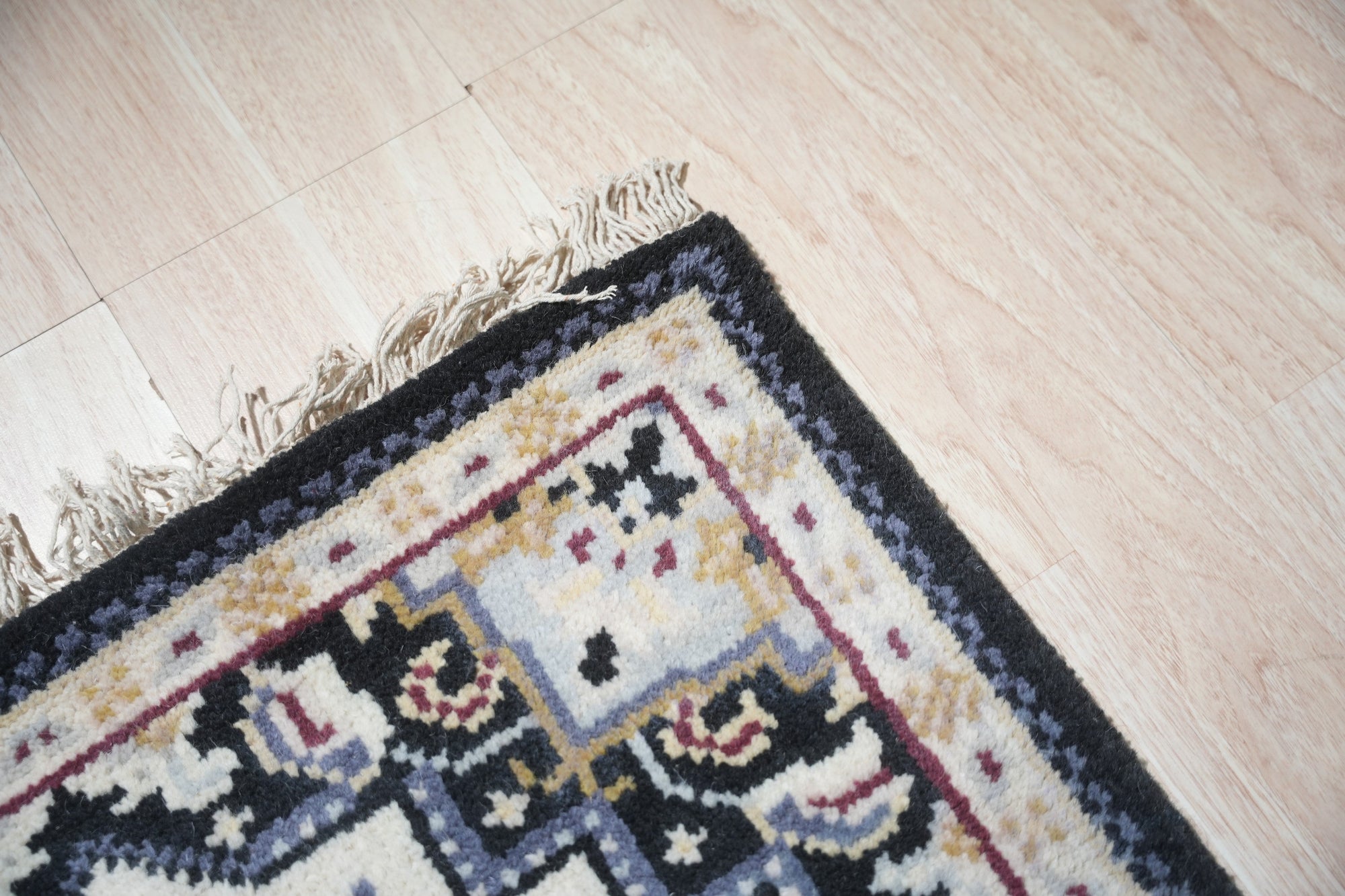 Luxurious Traditional Beige Hand Knotted Wool Rug, a finely woven beige wool rug with intricate traditional patterns, anchoring a softly lit living space.