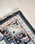 Luxurious Traditional Beige Hand Knotted Wool Rug, a finely woven beige wool rug with intricate traditional patterns, anchoring a softly lit living space.