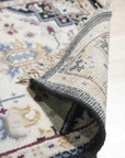 Luxurious Traditional Beige Hand Knotted Wool Rug, a beige wool rug featuring an ornate traditional design, draped elegantly to display its texture and pattern.