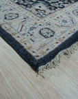 Luxurious Traditional Beige Hand Knotted Wool Rug, a beige wool rug with a traditional design, laying flat to showcase its pattern and texture.