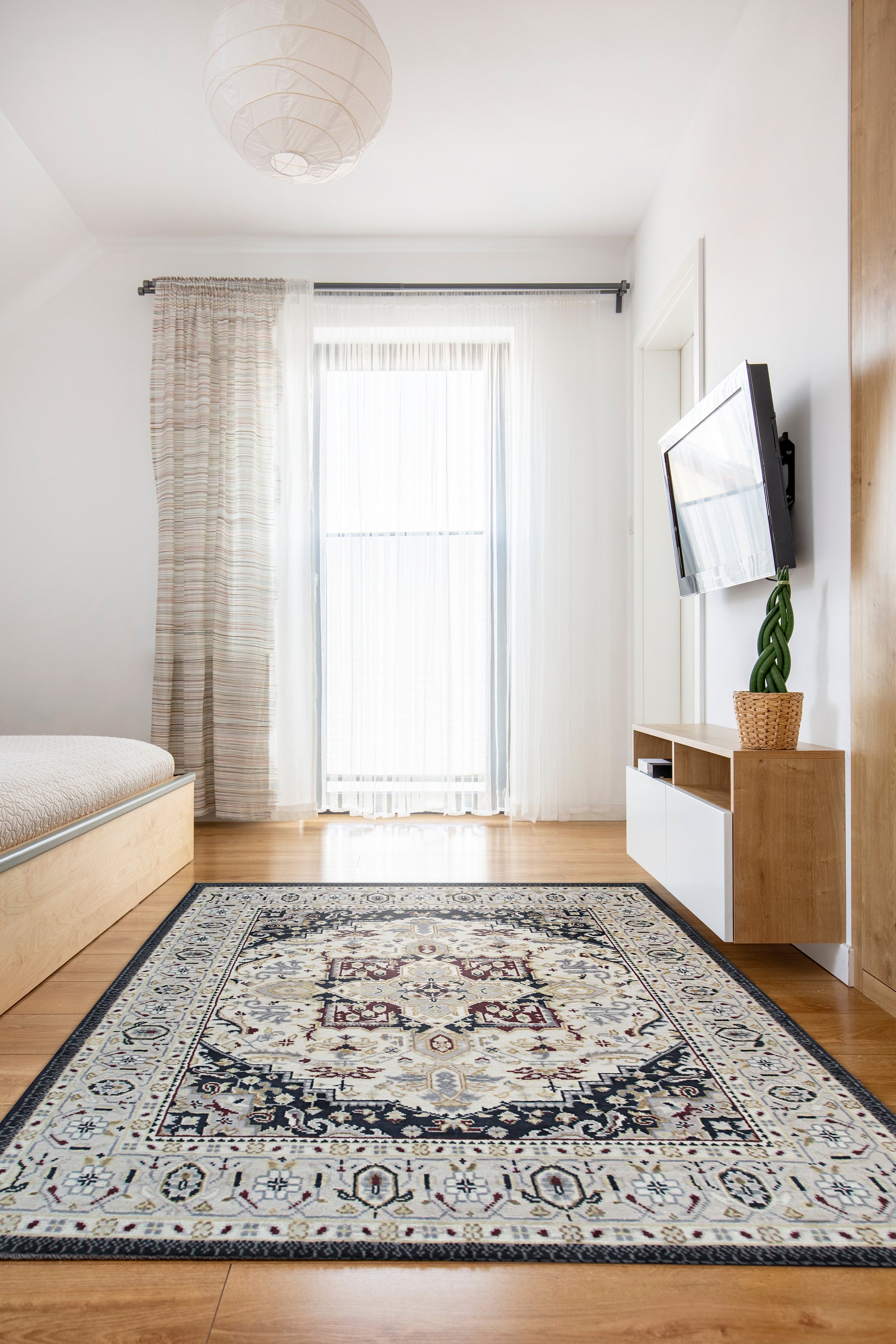 Luxurious Traditional Beige Hand Knotted Wool Rug, a beige wool rug with intricate traditional patterns, displayed in a bright, staged living room setting.