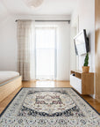 Luxurious Traditional Beige Hand Knotted Wool Rug, a beige wool rug with intricate traditional patterns, displayed in a bright, staged living room setting.