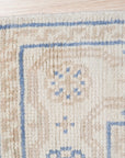 Ava Sophie Beige Hand Knotted Wool Rug, a warm, inviting layer adding subtle texture to a bright living space, showcasing its intricate hand-knotted construction and soft beige tones under natural light.