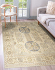 Ava Sophie Beige Hand Knotted Wool Rug, its subtle beige tones and hand-knotted texture enriching a bright, airy living room setting with hardwood floors and natural light.