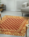 Chloe Trara Red Hand Knotted Wool Rug, a richly colored red wool rug with a traditional design, seen in a styled room setting.