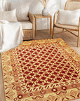 Chloe Trara Red Hand Knotted Wool Rug, showcasing rich reds and subtle patterns woven into a plush wool texture, lending warmth and intricate design to a stylish living space.