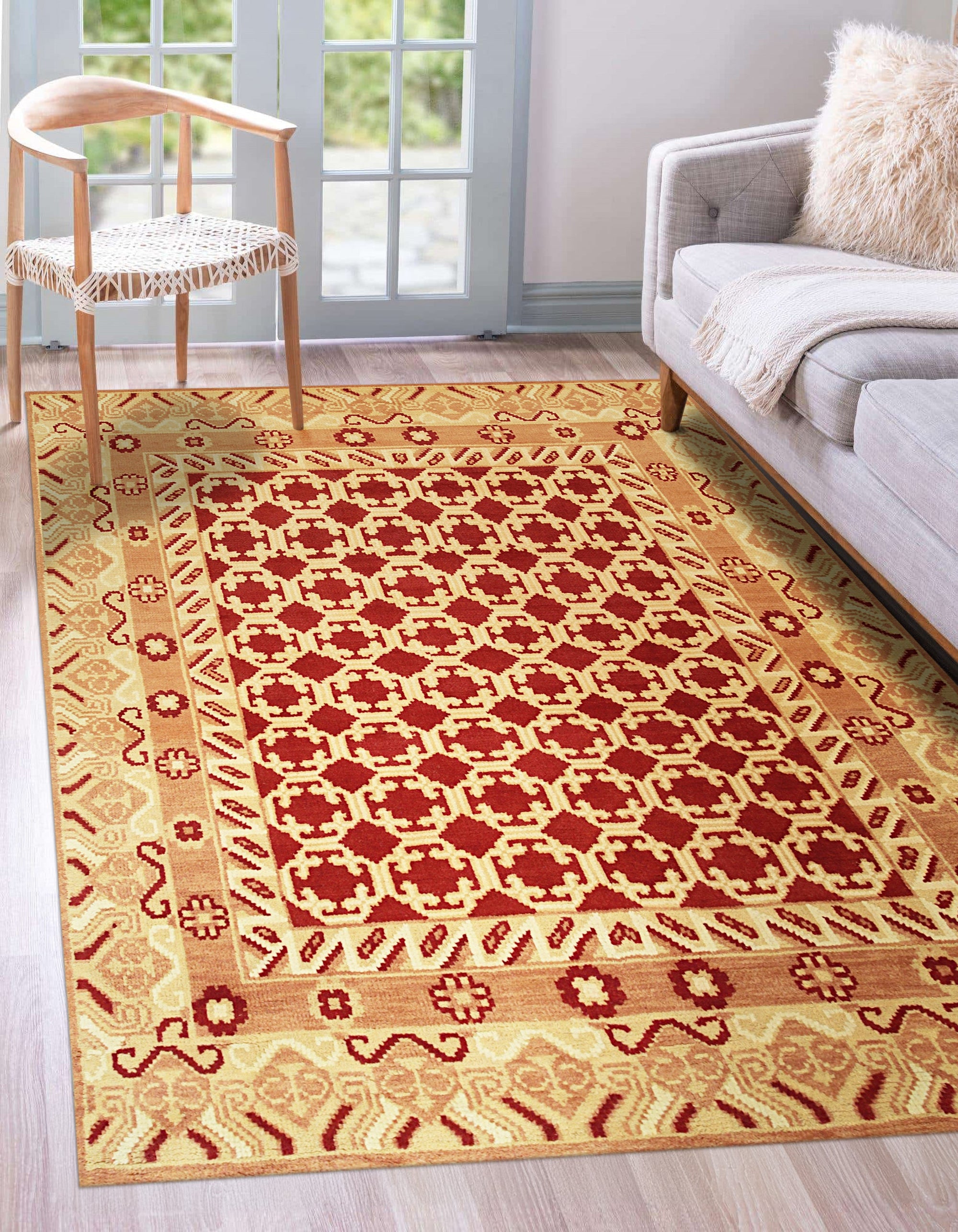 Chloe Trara Red Hand Knotted Wool Rug, a vibrant red and hand-knotted wool rug, showcasing intricate patterns and textures in a warm, inviting living space.
