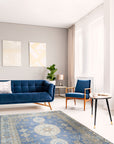 Handcrafted Traditional Blue Hand Knotted Wool Rug, a rich blue wool rug featuring an intricate traditional pattern, displayed in a brightly lit room to showcase its detail and color variations.