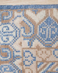 Handcrafted Traditional Blue Hand Knotted Wool Rug, a vibrant navy and cream wool rug featuring a classic, intricate pattern, displayed on a polished wooden floor in a warmly lit interior.